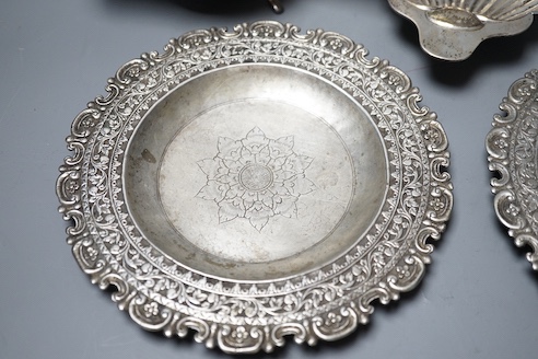 A late Victorian silver butter shell, a later silver sauceboat, seven assorted silver teaspoons including Scottish and two continental white metal dishes(a.f.), gross 16.5oz.